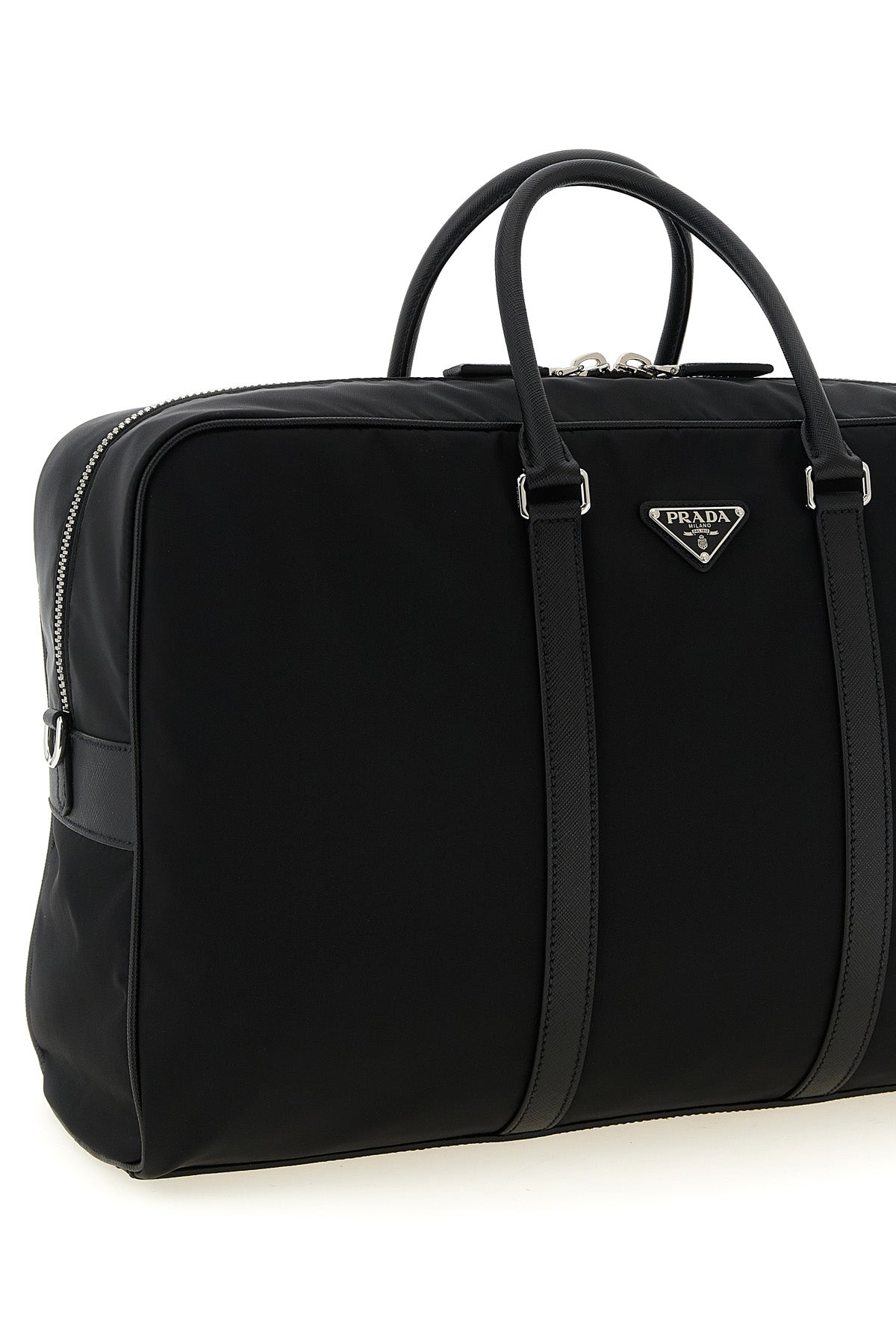 Detail of enameled triangle logo on Prada bag