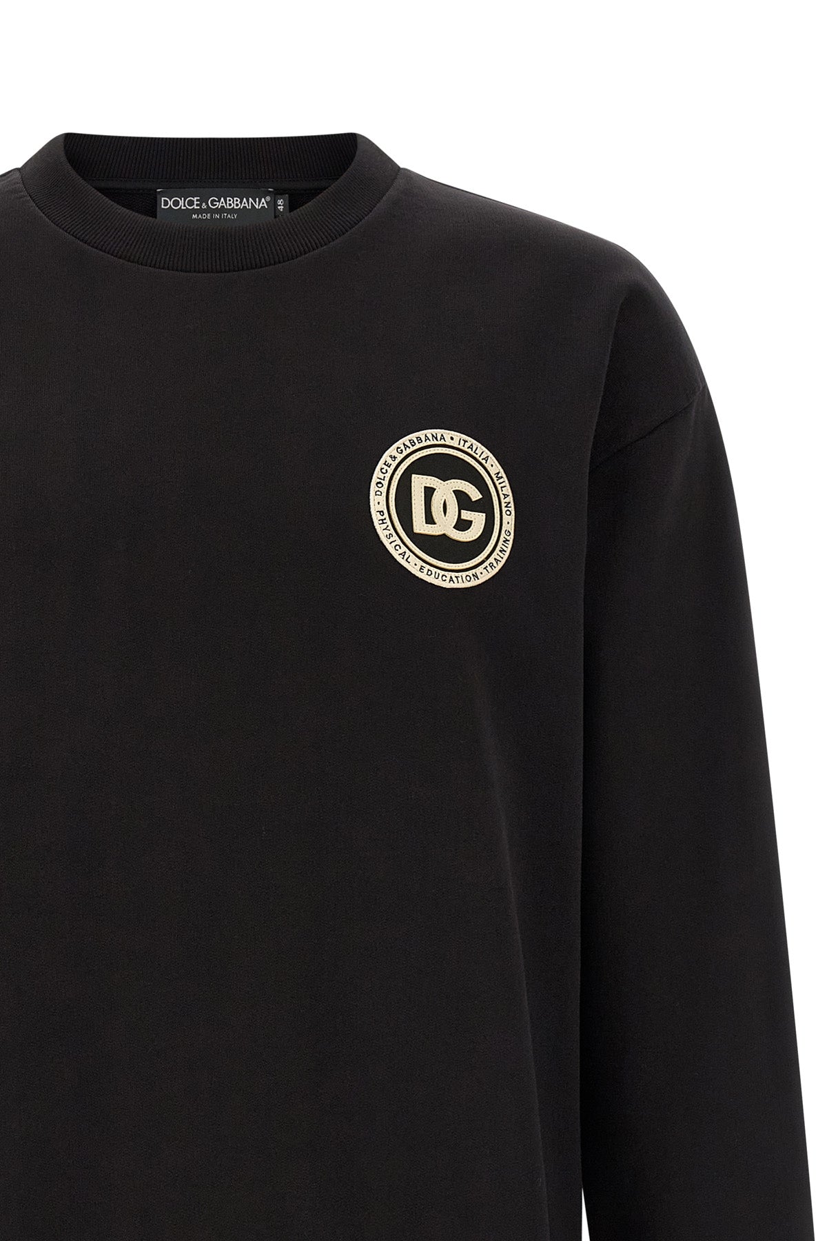 Close-up of Dolce & Gabbana circular DG patch on chest